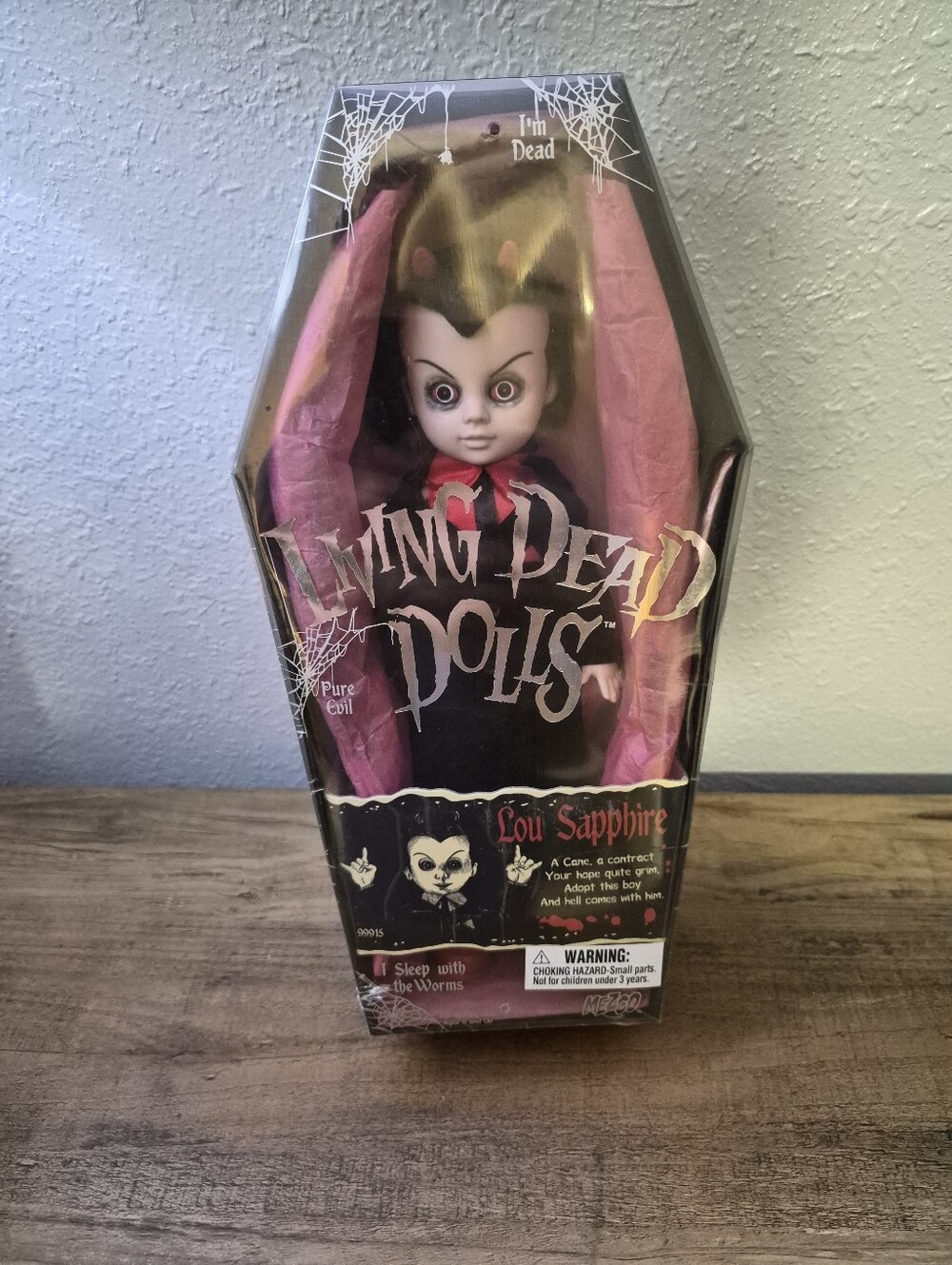 Living Dead Dolls "Lou Sapphire" Mezco Horror Collectible Doll – Sealed in Coffi